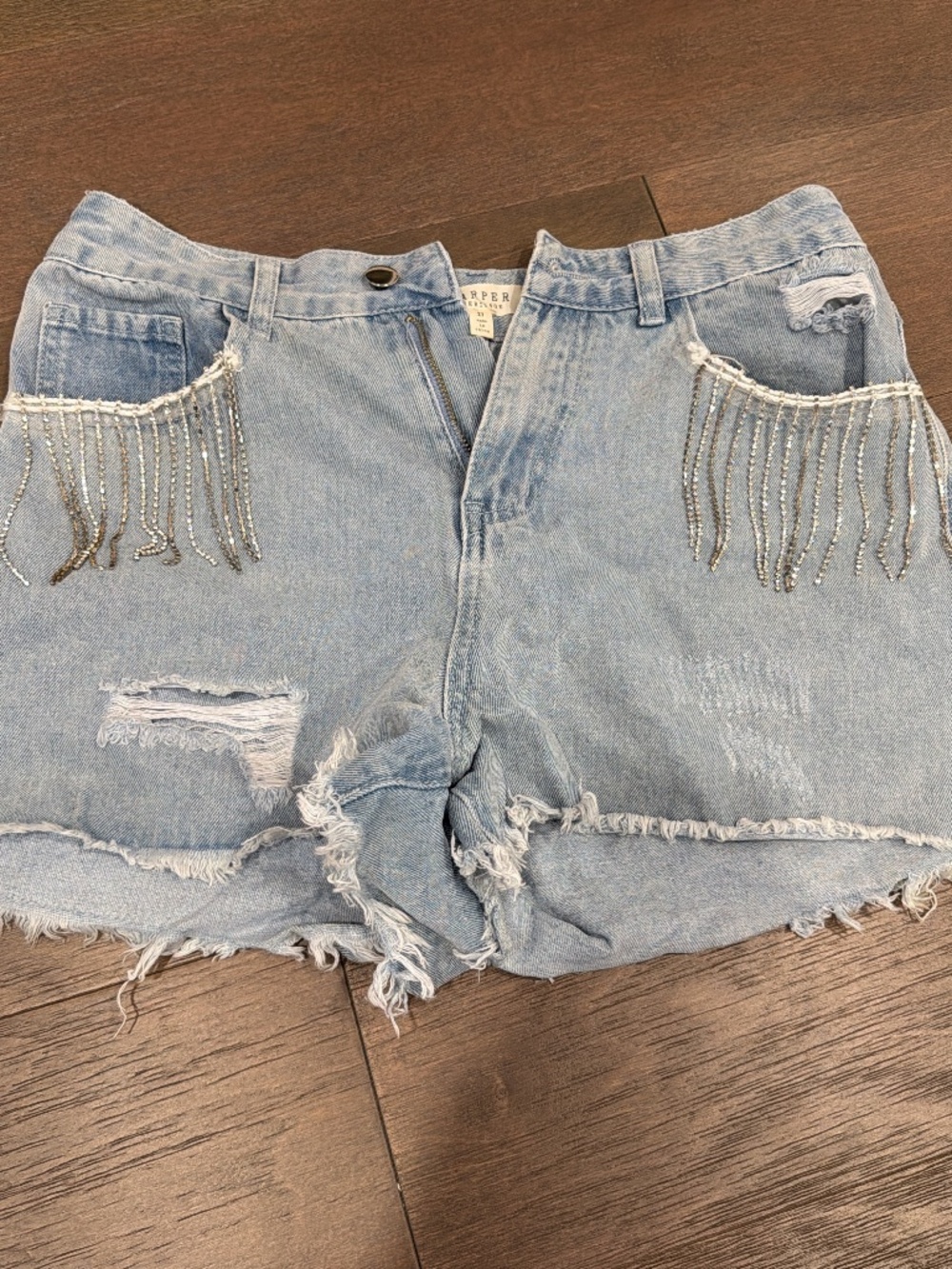 Denim shorts with rhinestone fringe detail